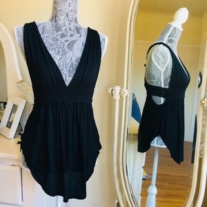 Low cut black flowy tank top with lace detail.